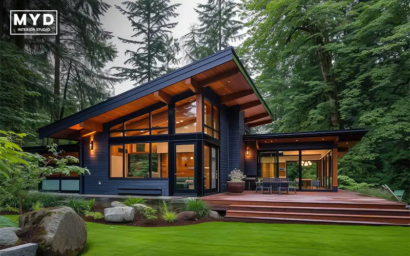Modern house exterior surrounded by lush green trees. 