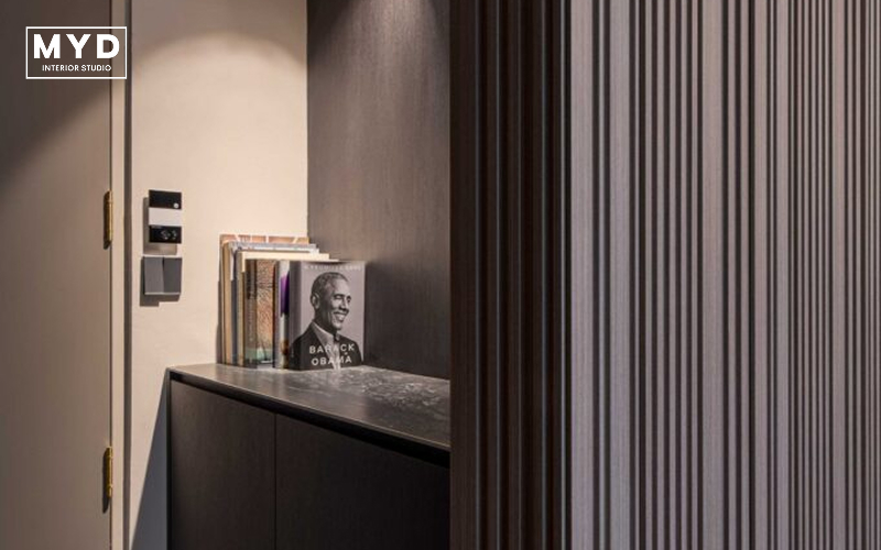 Modern entryway with built-in bookshelf showcasing home renovation ideas