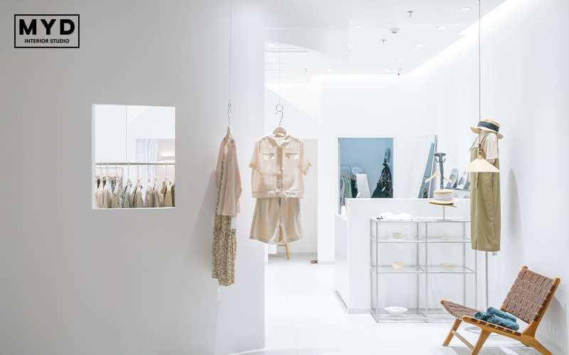 Minimalist retail boutique with white walls.