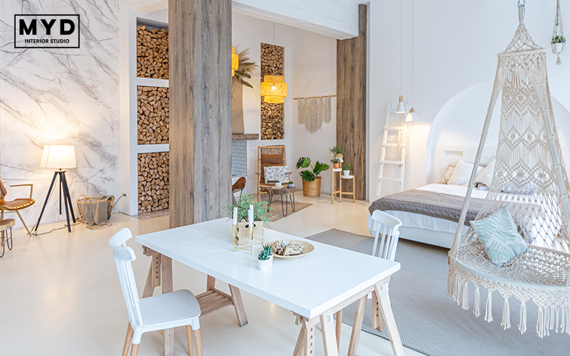 Modern retail space with a macrame hammock chair.